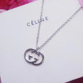 GUCCI 26S INTERLOCKING G LOGO PENDANT NECKLACE IN SILVER TONE METAL