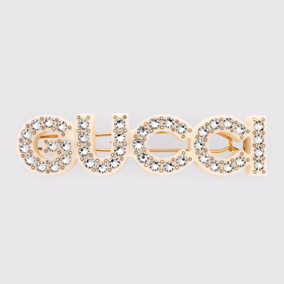 GUCCI 26S CRYSTAL EMBELLISHED SCRIPT LOGO STATEMENT BROOCH IN GOLD TONE METAL 629881