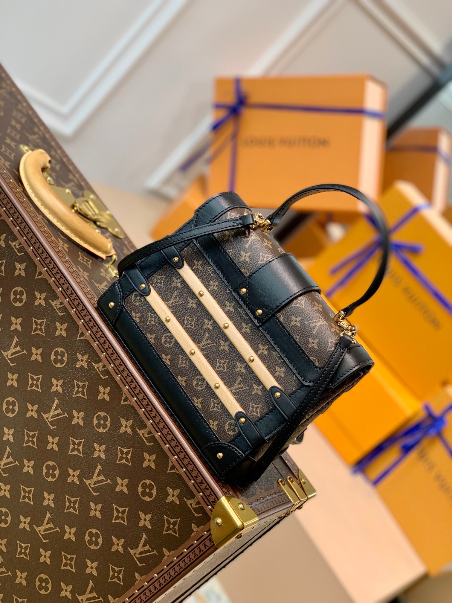 TRIANON PM 21 IN BROWN MONOGRAM COATED CANVAS AND BLACK CALFSKIN SIGNATURE S-LOCK