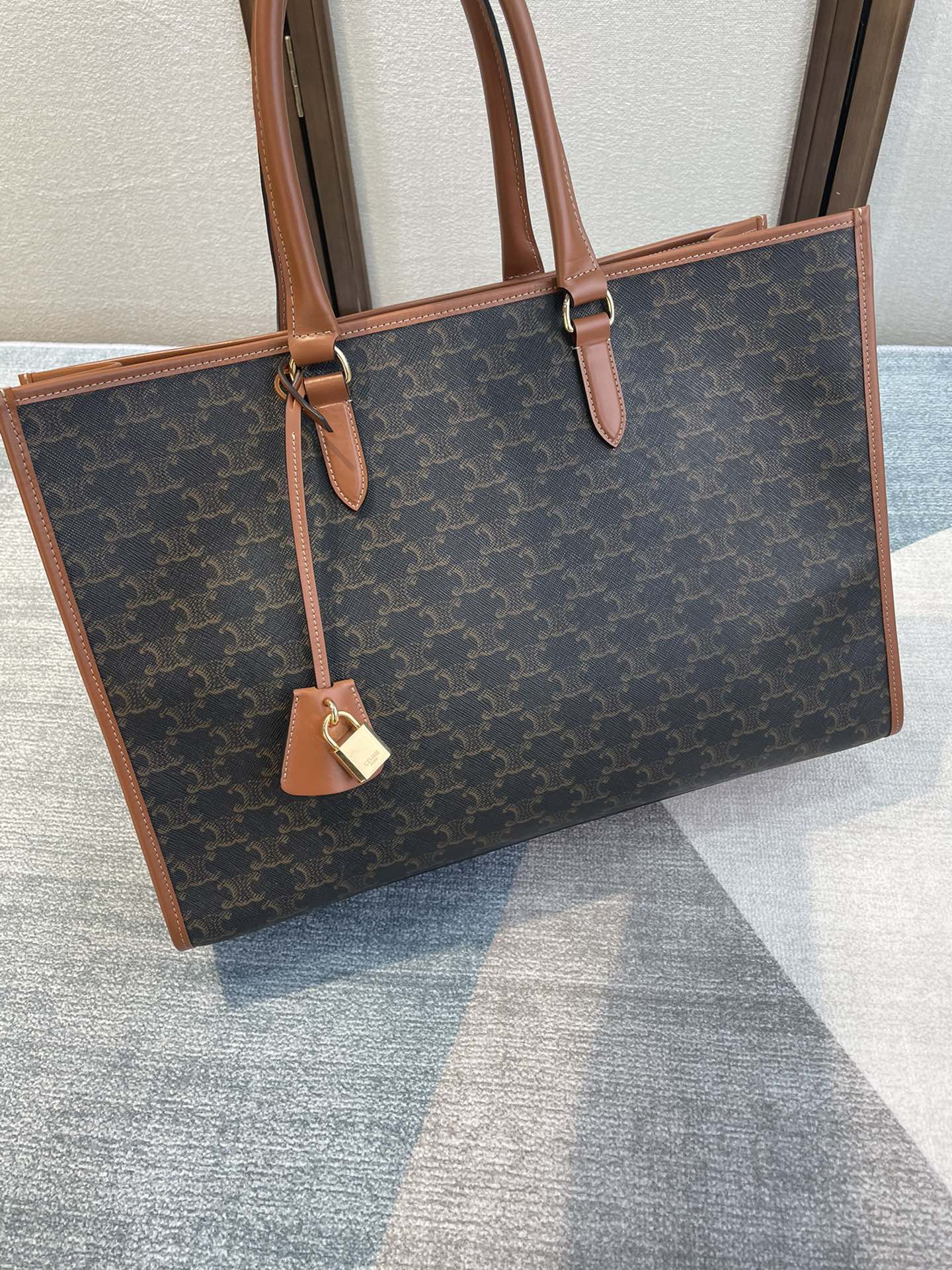 CELINE 25S HORIZONTAL CABAS 43MM IN BLACK TRIOMPHE CANVAS AND TAN BROWN CALFSKIN