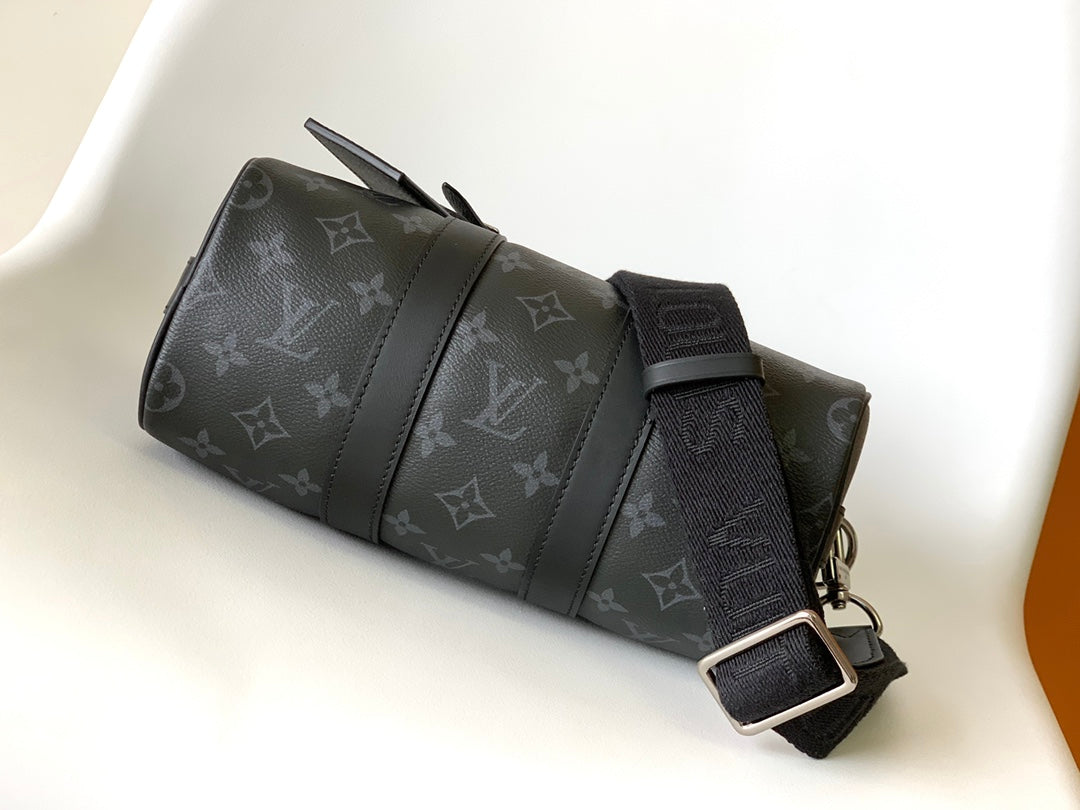 KEEPALL BANDOULIÈRE 25 IN BLACK MONOGRAM HERITAGE CANVAS