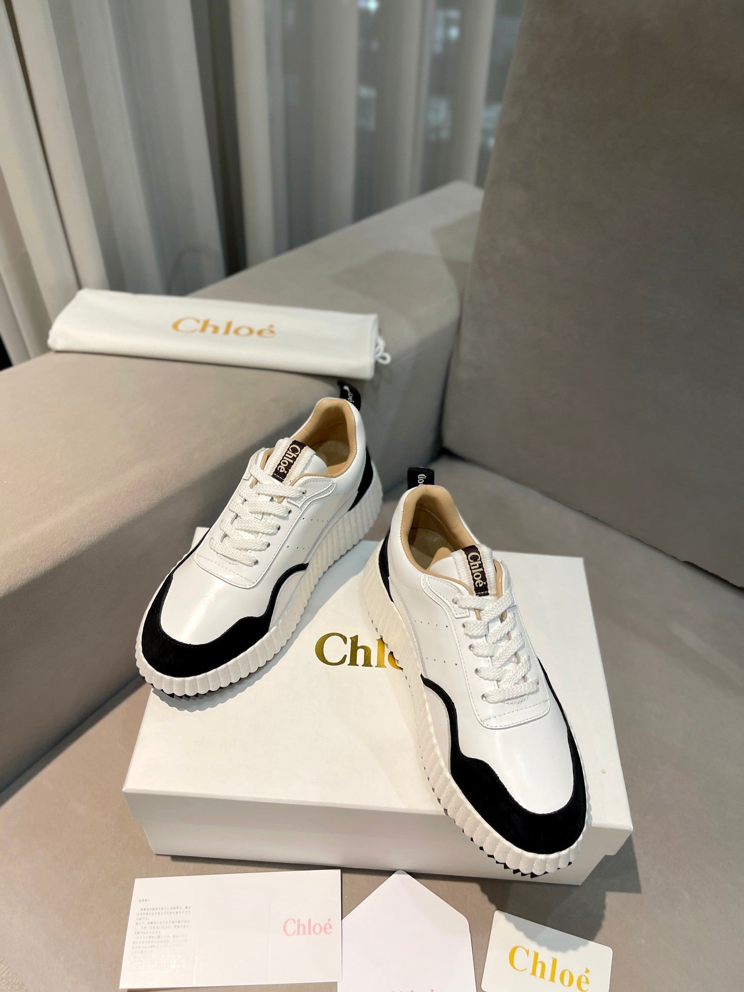 NAMA SNEAKER IN WHITE LAMBSKIN AND BLACK SUEDE