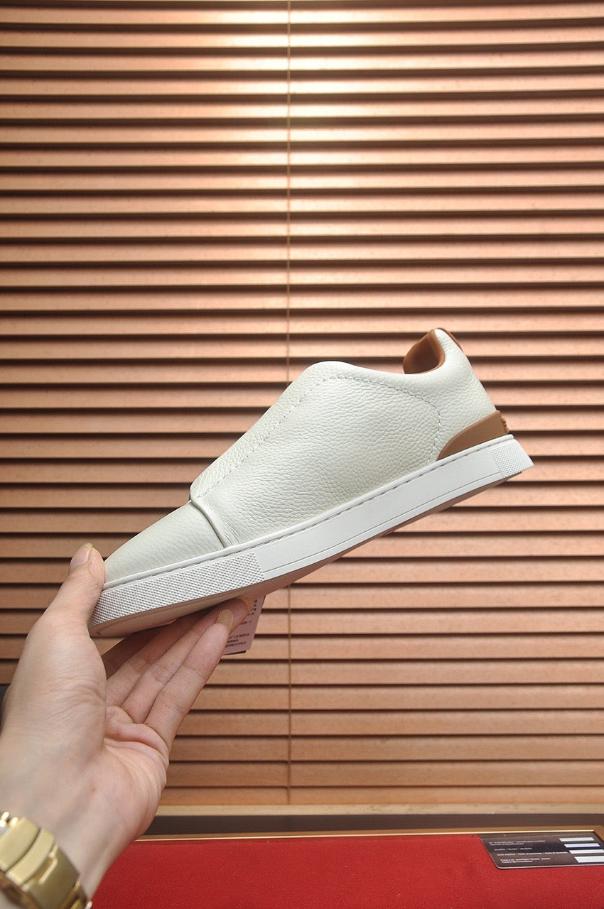 LOW-TOP SNEAKERS IN WHITE GRAINED CALFSKIN