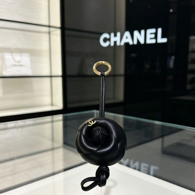 CHANEL CAMELLIA BAG CHARM IN BLACK LAMBSKIN