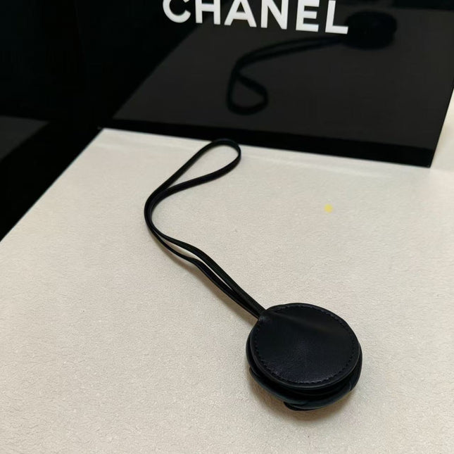 CHANEL CAMELLIA BAG CHARM IN BLACK LAMBSKIN