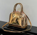 SPEEDY 23 IN GOLD MONOGRAM EMBOSSED CALFSKIN