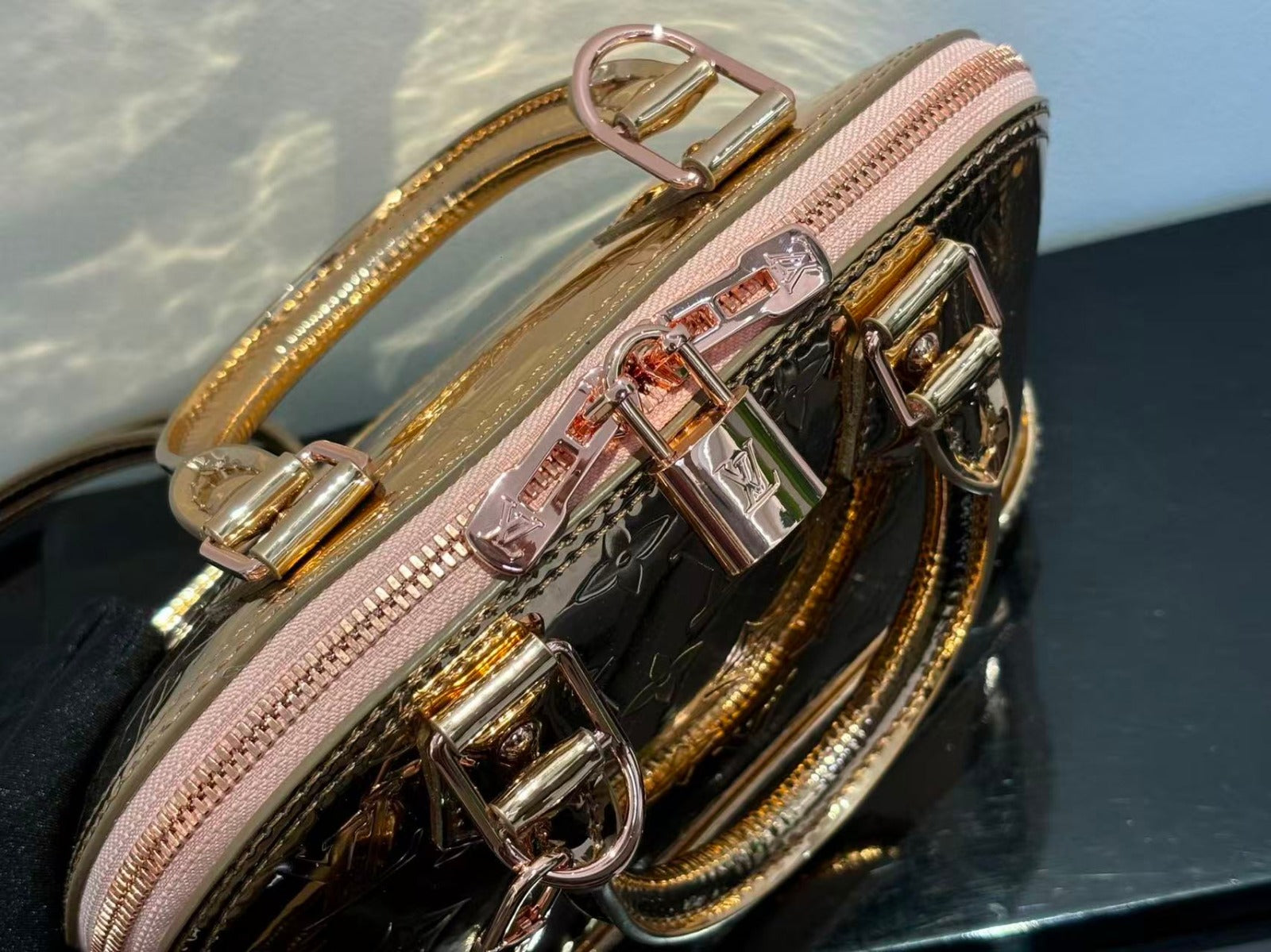 SPEEDY 23 IN GOLD MONOGRAM EMBOSSED CALFSKIN