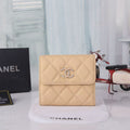 CHANEL FLAP CARD HOLDER IN BEIGE CAVIAR CALFSKIN WITH CRYSTAL EMBOSSED LOGO