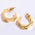 FENDI 26S FF LOGO HUGGIE HOOP EARRINGS IN GOLD TONE METAL 635065