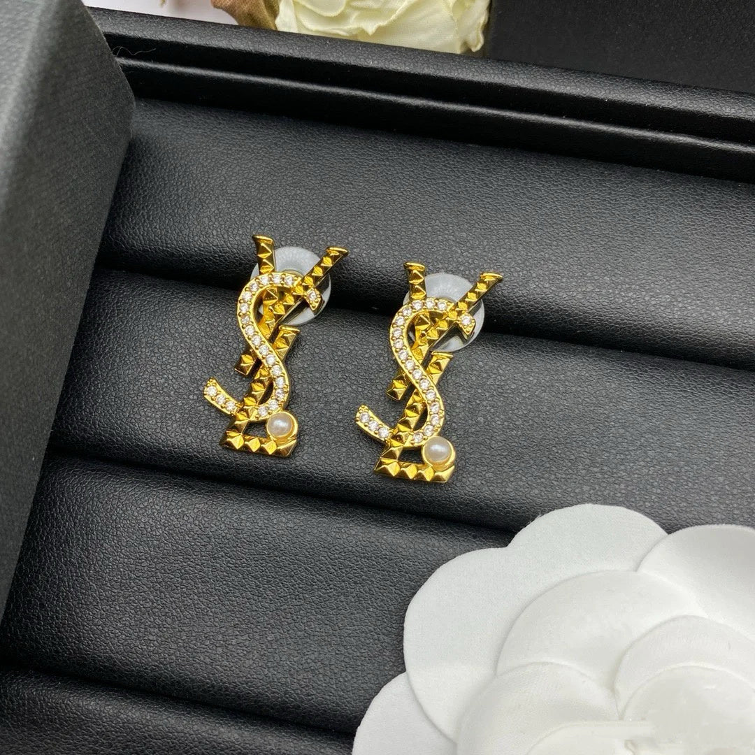 YSL 26S STUDDED CRYSTAL PEARL LOGO EARRINGS IN GOLD TONE METAL 629138