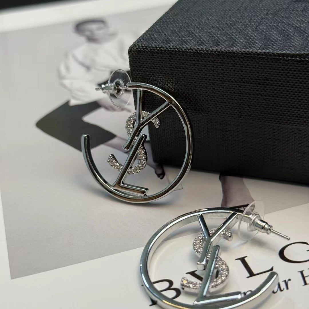 YSL 26S CRYSTAL LOGO HOOP EARRINGS IN SILVER TONE METAL 629137