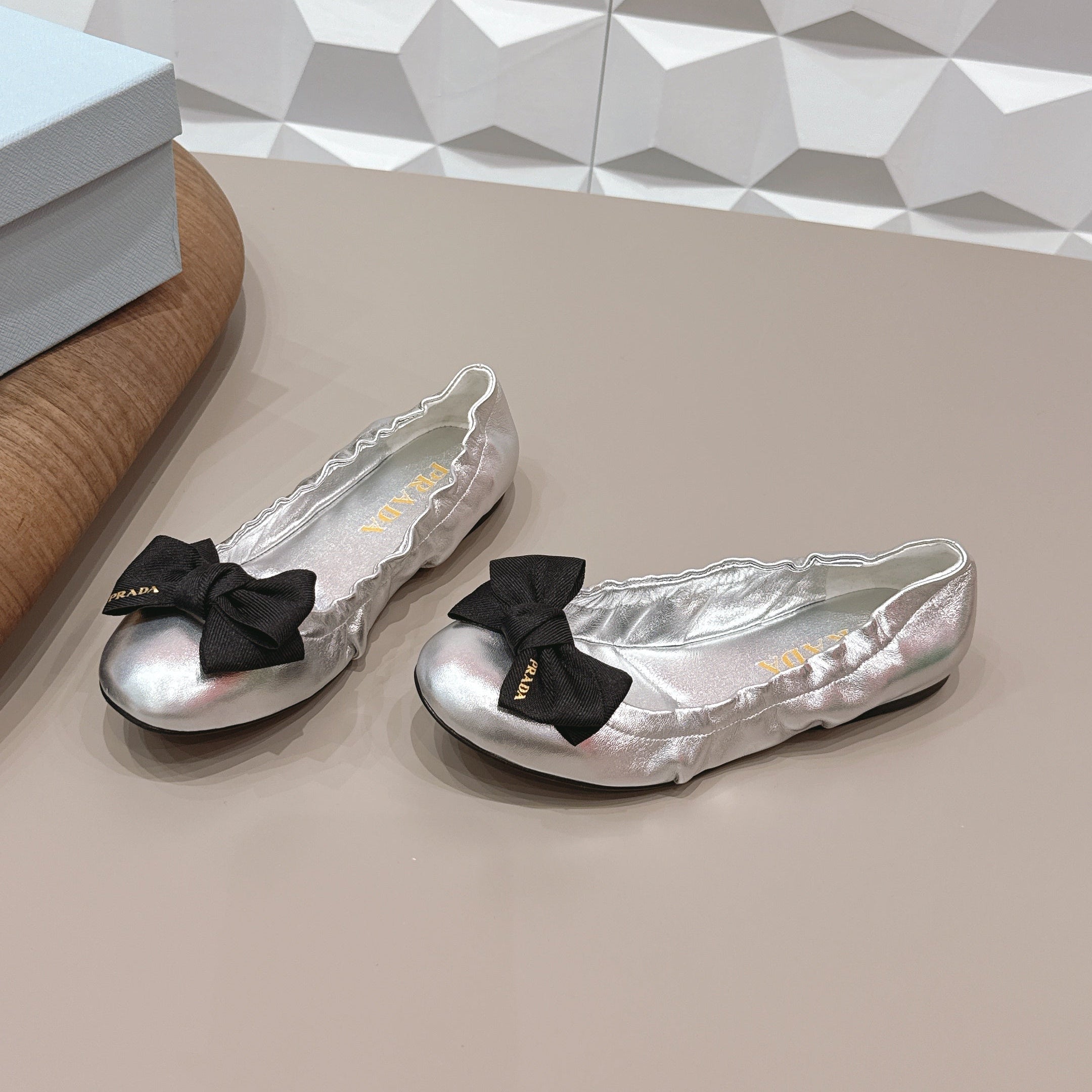 PRADA 26S ROUND TOE FLATS WITH BOW IN SILVER CALFSKIN