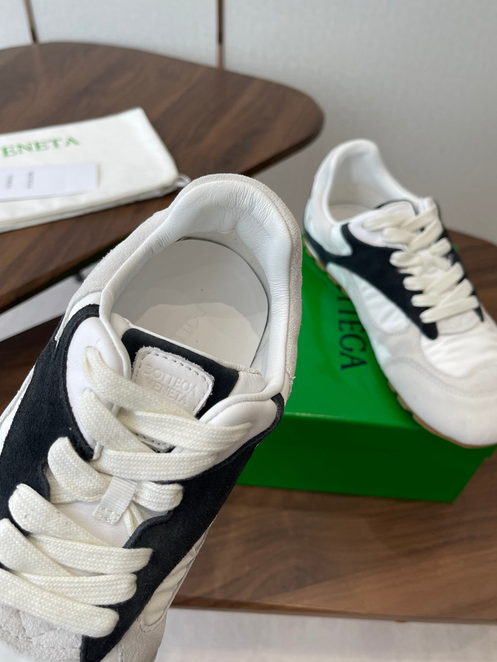 BOTTEGA VENETA 26S ORBIT FLASH SNEAKERS IN WHITE AND BLACK SUEDE