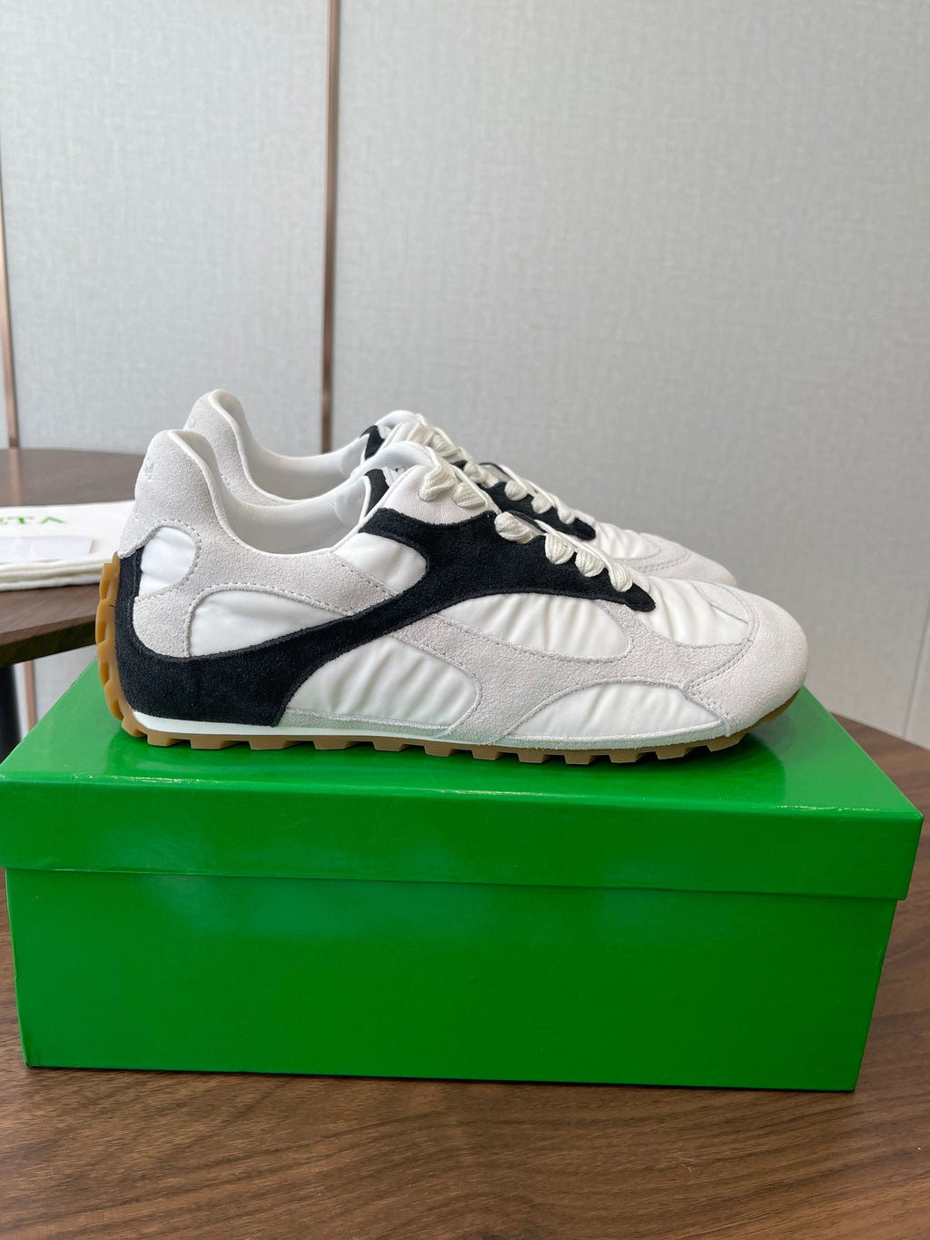BOTTEGA VENETA 26S ORBIT FLASH SNEAKERS IN WHITE AND BLACK SUEDE
