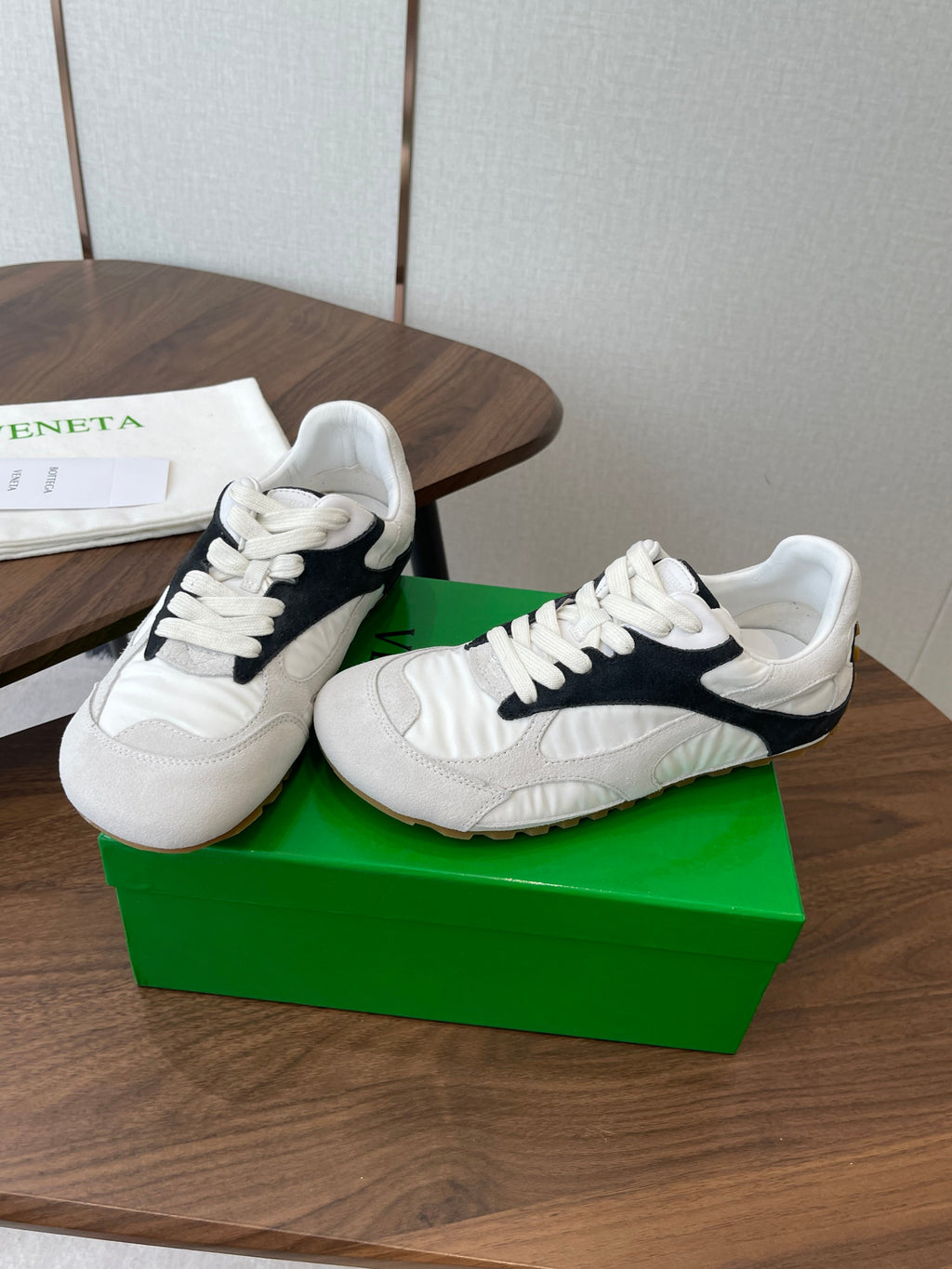 BOTTEGA VENETA 26S ORBIT FLASH SNEAKERS IN WHITE AND BLACK SUEDE