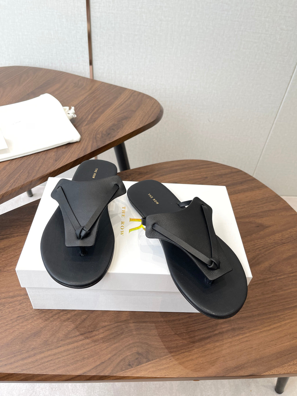 THE ROW 26S T STRAP THONG SANDALS IN BLACK CALFSKIN