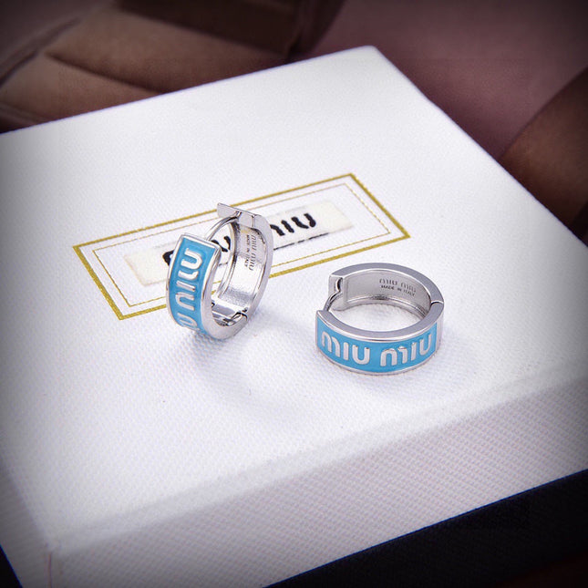 MIUMIU 26S LOGO HUGGIE HOOP EARRINGS IN LIGHT BLUE ENAMEL AND SILVER TONE METAL 622799