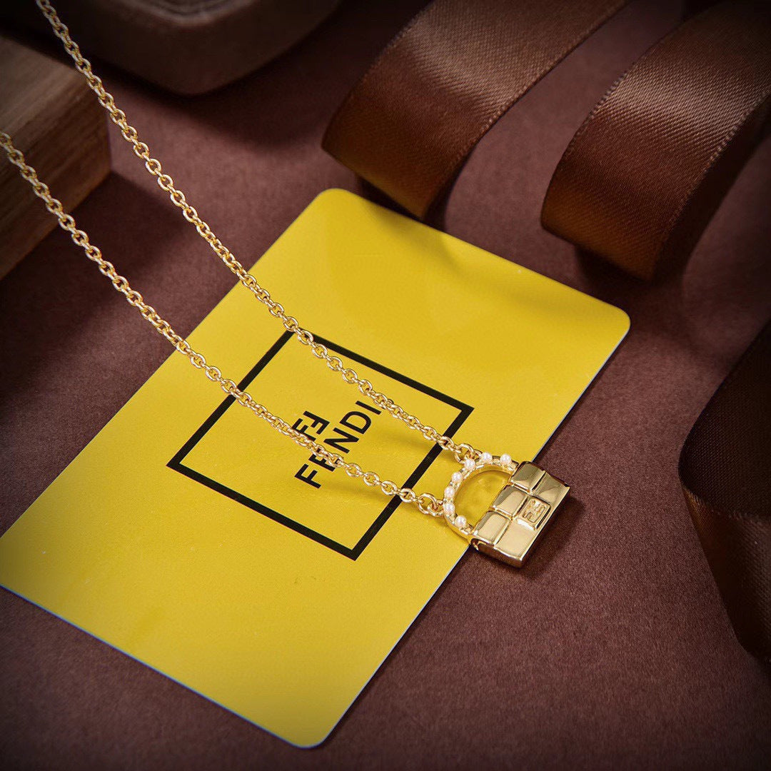 FENDI 26S BAG CHARM PENDANT NECKLACE IN GOLD TONE METAL 625602