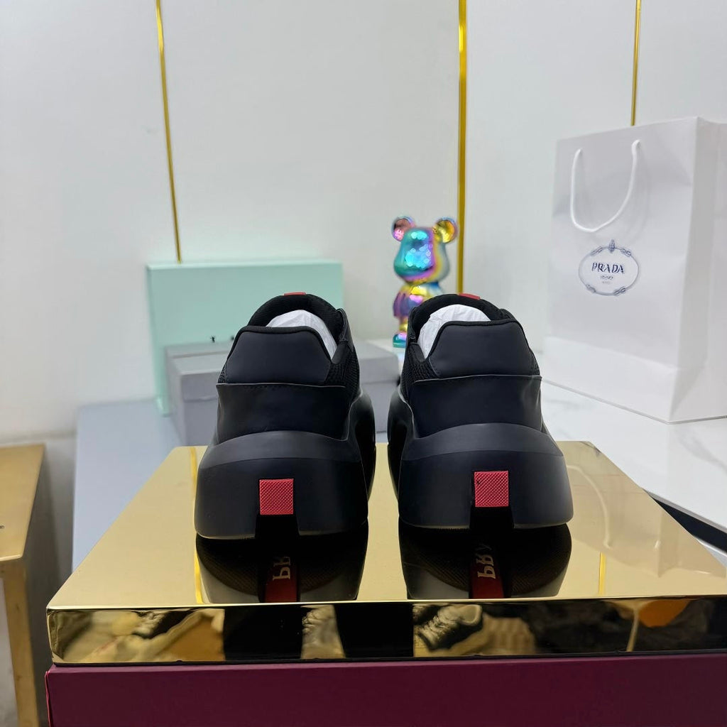 PRADA 25S CROSS LACED SNEAKERS IN BLACK CALFSKIN