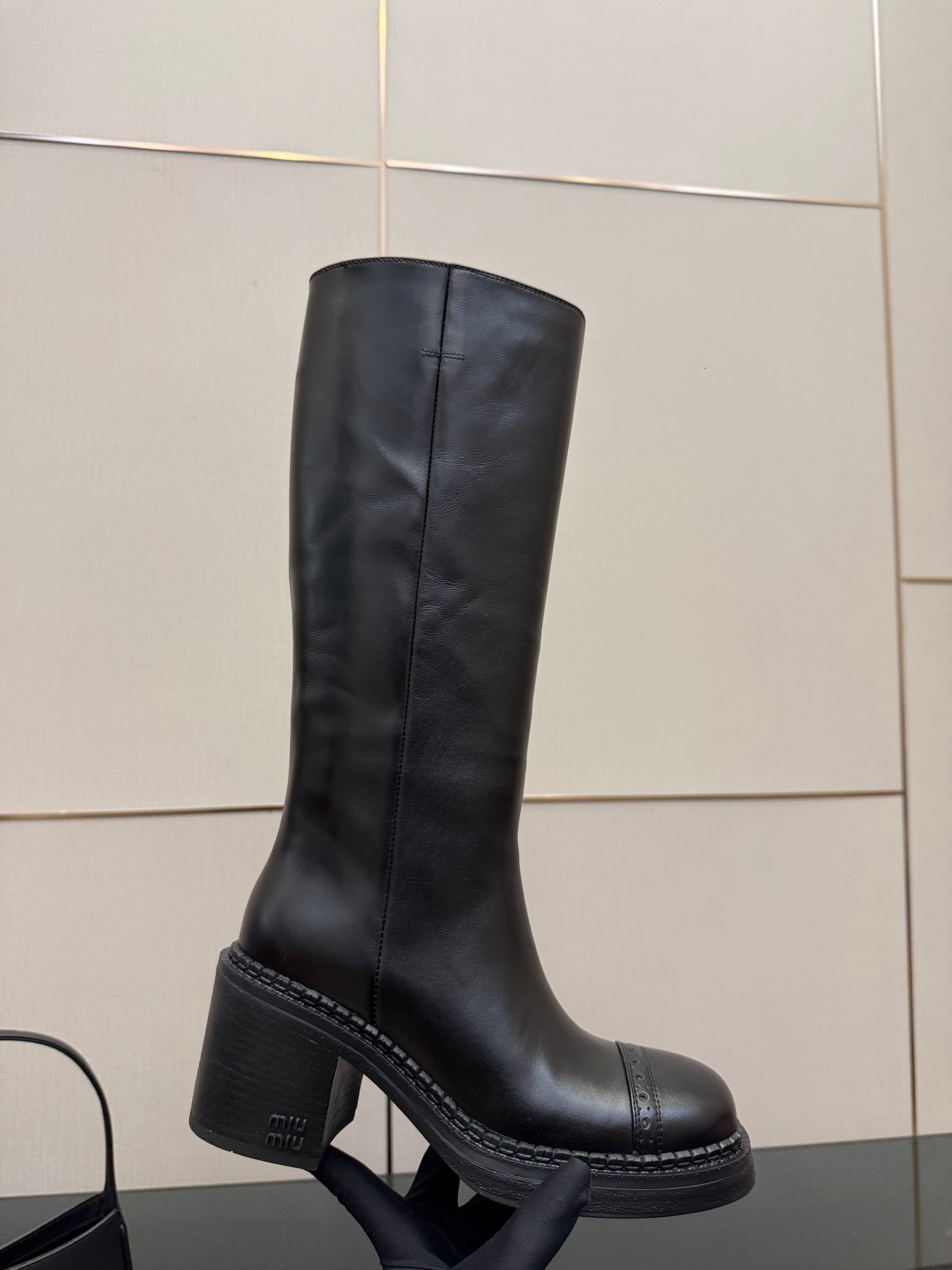 MIUMIU 25S KNEE-HIGH BOOTS IN BLACK CALFSKIN