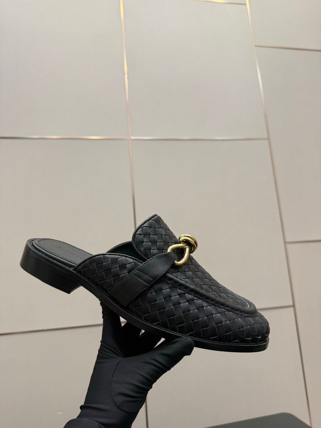 BOTTEGA VENETA 26S BACKLESS LOAFERS IN BLACK TECHNICAL WOVEN CALFSKIN