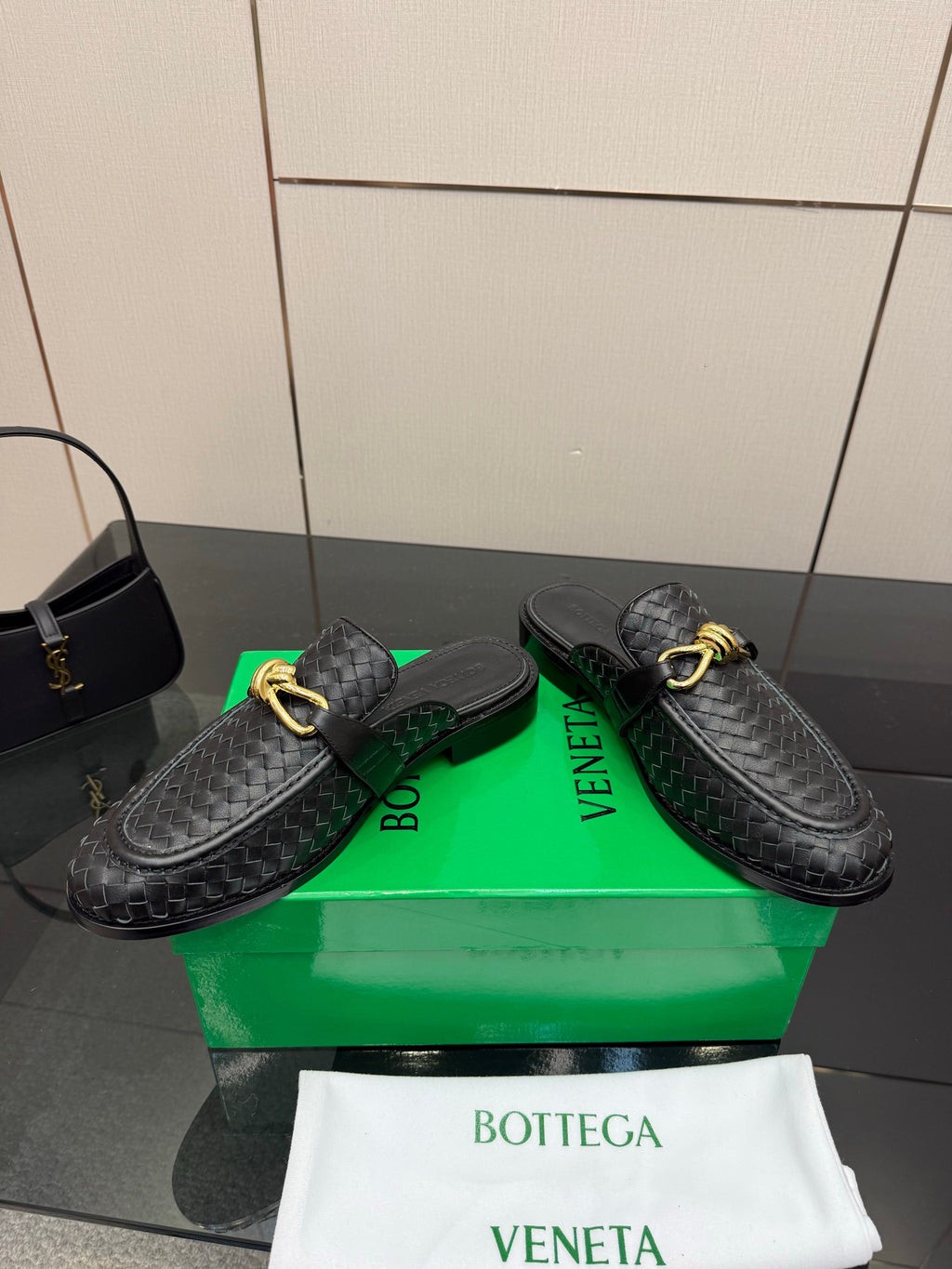 BOTTEGA VENETA 26S BACKLESS LOAFERS IN BLACK TECHNICAL WOVEN CALFSKIN