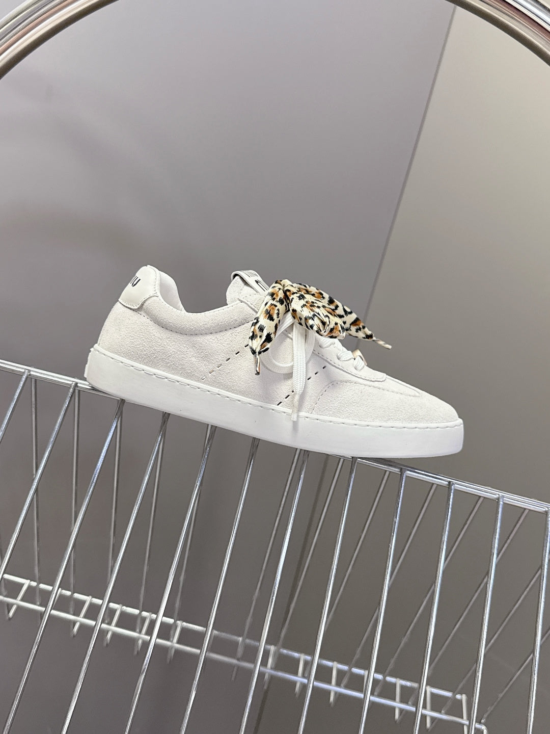 MIUMIU 25S SNEAKERS IN WHITE SUEDE WITH LEOPARD-PRINT LACES