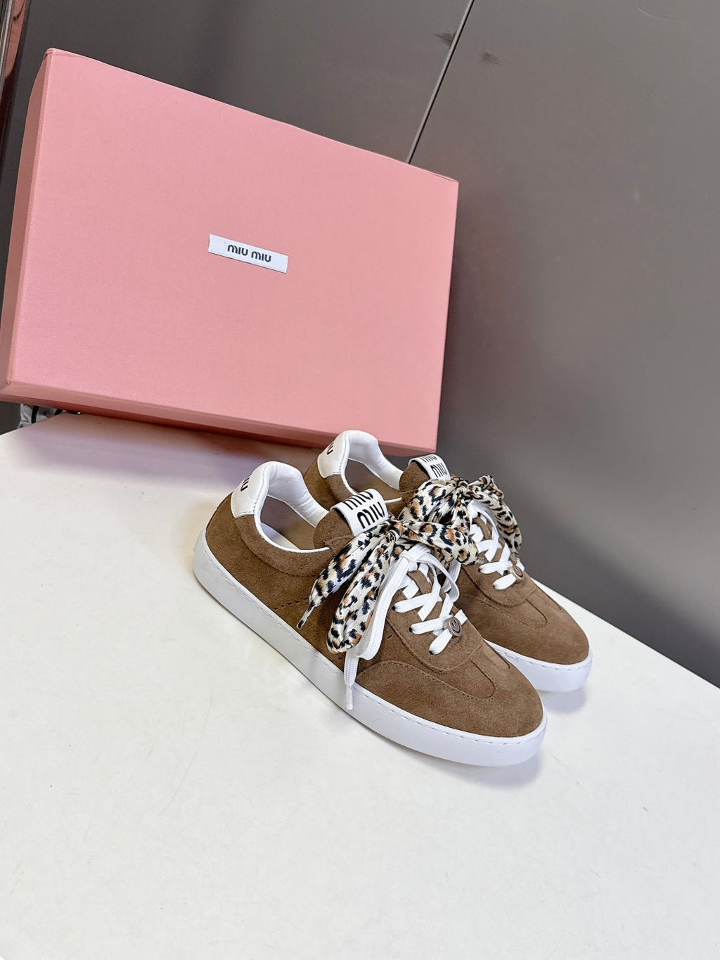 MIUMIU 25S SNEAKERS IN EARTH BROWN SUEDE WITH LEOPARD-PRINT LACES