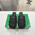 BOTTEGA VENETA 26S WOVEN MULES IN BLACK LAMBSKIN