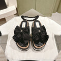 CC SLIPPERS WITH SILK BOW IN BLACK COWHIDE