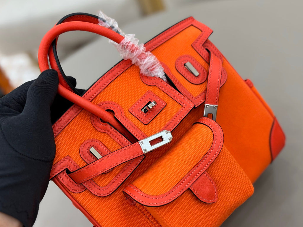 HM 25S BIRKIN CARGO 25 CM IN DARK ORANGE CANVAS AND SWIFT WITH SILVER HARDWARE