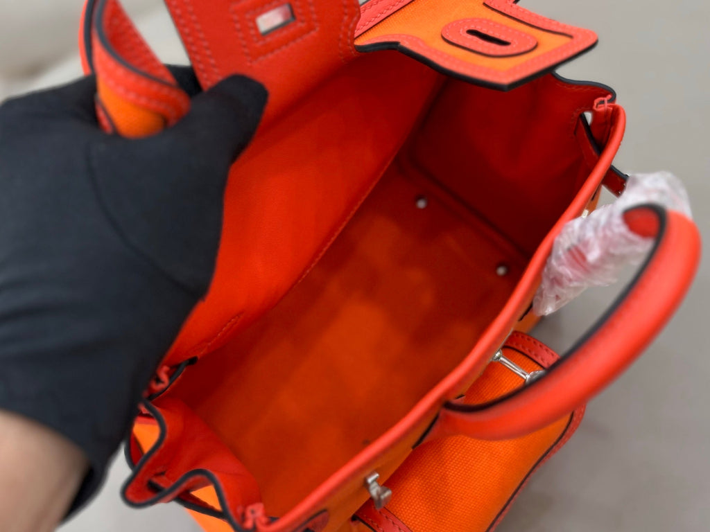 HM 25S BIRKIN CARGO 25 CM IN DARK ORANGE CANVAS AND SWIFT WITH SILVER HARDWARE