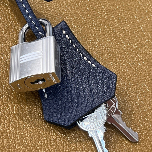 HM 25S BIRKIN 25 CM IN EARTH BROWN AND NAVY BLUE COWHIDE WITH KEY SILVER
