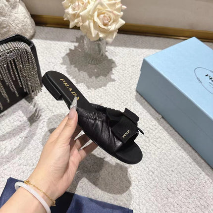 PRADA 26S RUCHED BOW SLIDE SANDALS IN BLACK CALFSKIN