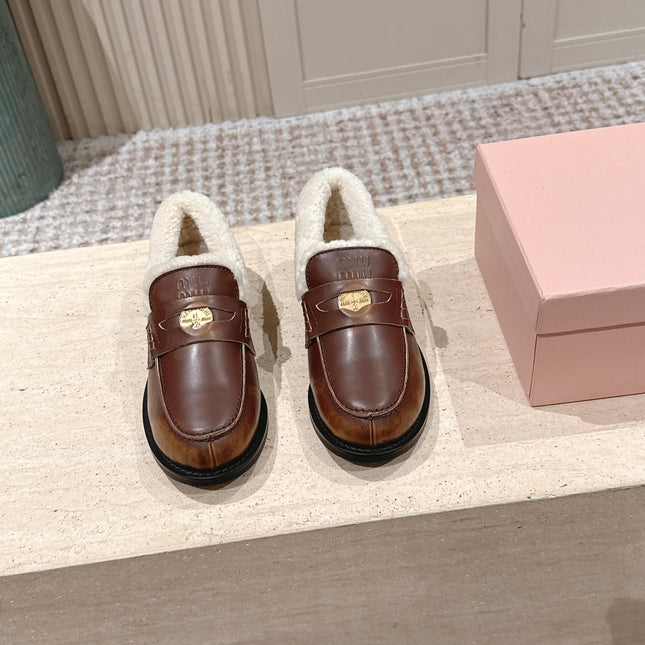 MIUMIU 25S PENNY LOAFERS 20MM IN EBONY BROWN BLEACHED CALFSKIN WITH SHEARLING