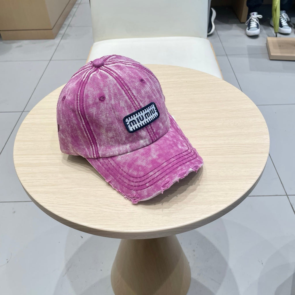 MIUMIU DISTRESSED FABRIC BASEBALL CAP IN PINK WITH EMBROIDERED LOGO