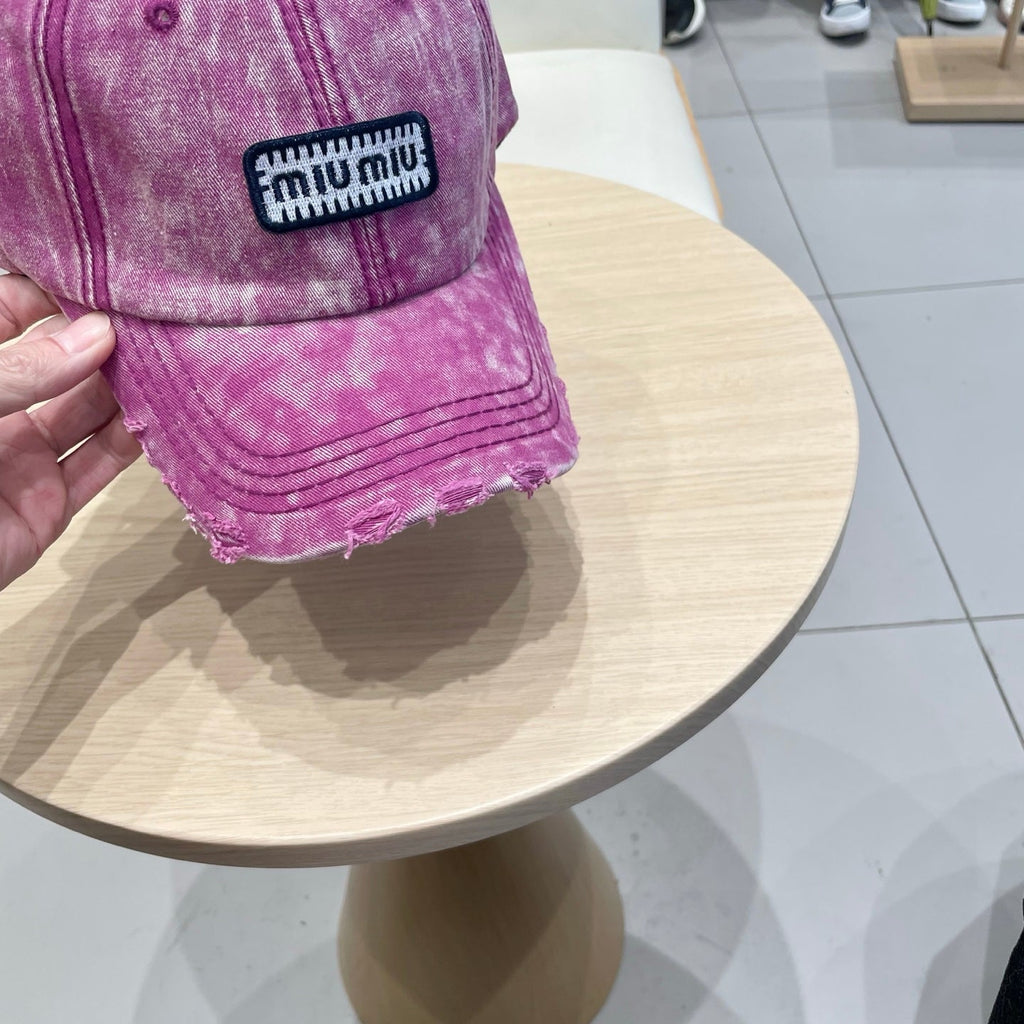 MIUMIU DISTRESSED FABRIC BASEBALL CAP IN PINK WITH EMBROIDERED LOGO