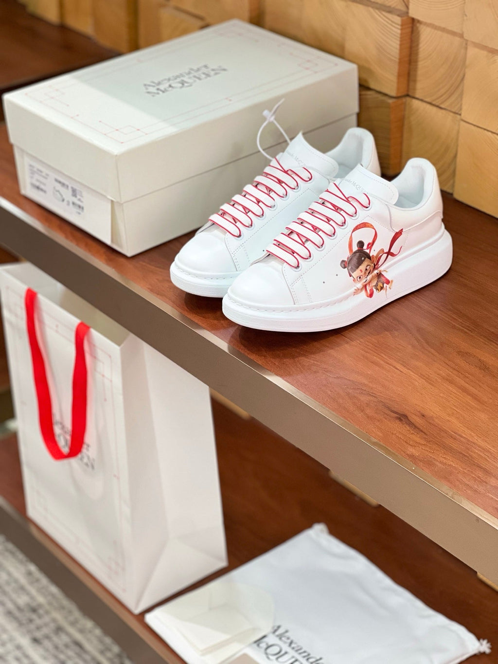 OVERSIZED SNEAKERS IN WHITE CALFSKIN WITH CARTOON FIGURE