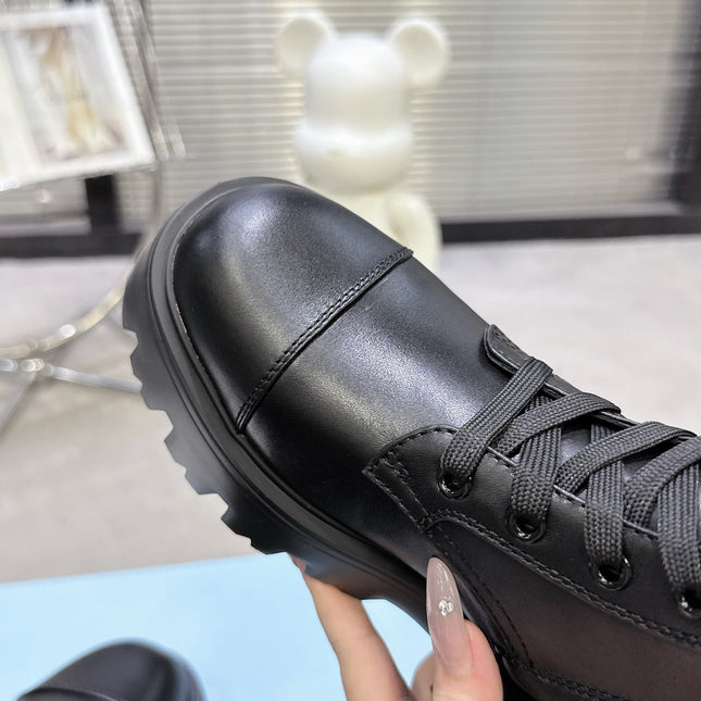 PRADA 25S WARRIOR BOOTS IN BLACK CALFSKIN
