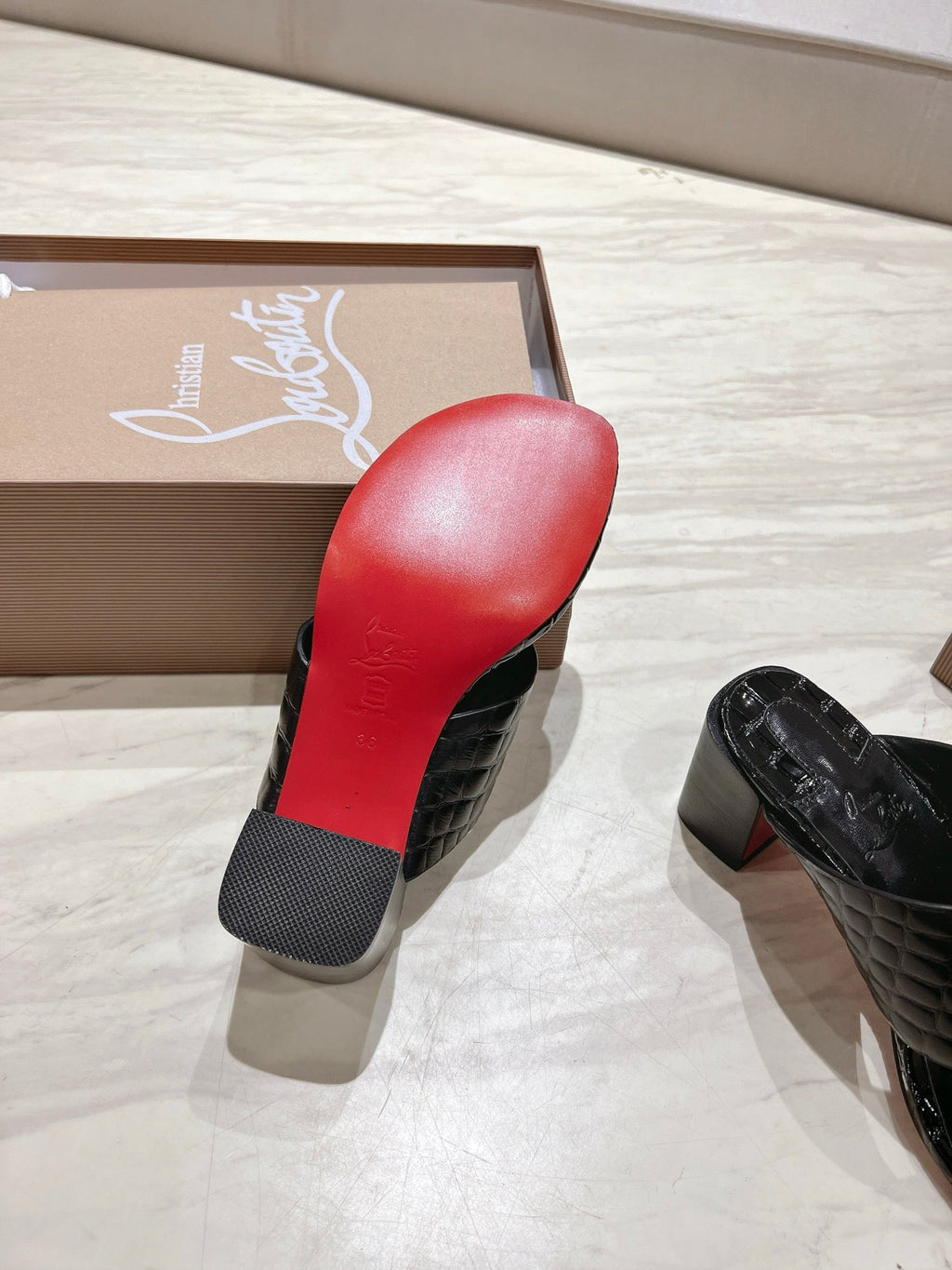 EMBOIDERED LOGO MULES IN BLACK EMBOSSED CALFSKIN