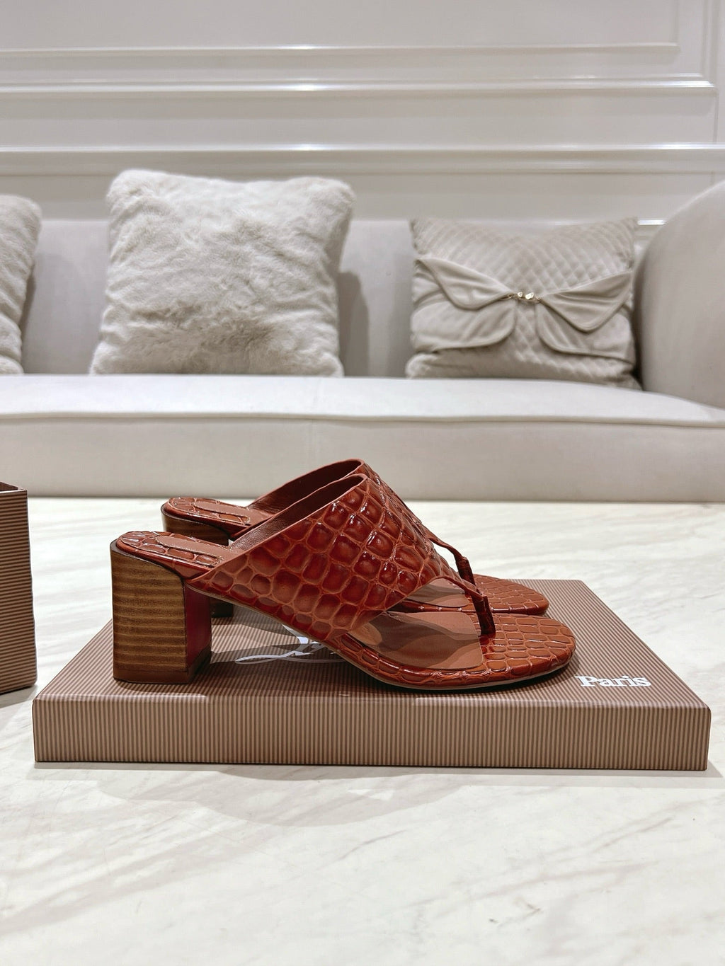 EMBOIDERED LOGO MULES IN COGNAC BROWN EMBOSSED CALFSKIN