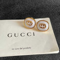 GUCCI 26S INTERLOCKING G ROUND LOGO STUD EARRINGS IN WHITE ENAMEL & GOLD TONE METAL 625717
