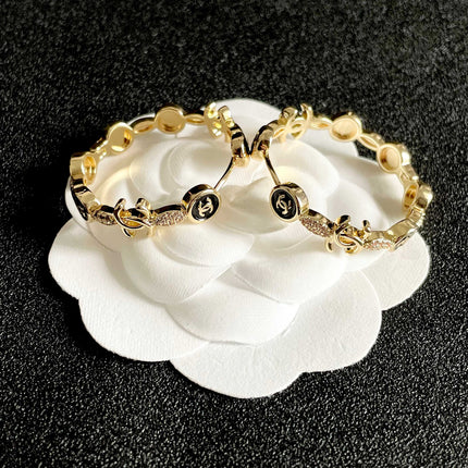 CHANEL 26S DOUBLE C LOGO BLACK ENAMEL & CRYSTAL LINK HOOP EARRINGS IN GOLD METAL 629897