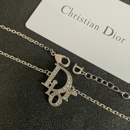 CD 26S CRYSTAL DIOR LOGO PENDANT NECKLACE IN SILVER METAL 631900