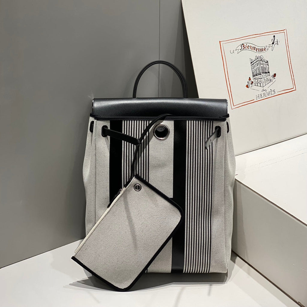 HERBAG A DOS ZIP RETOURNE BACKPACK 29 IN OFF-WHITE MIX BLACK CANVAS AND CALFSKIN