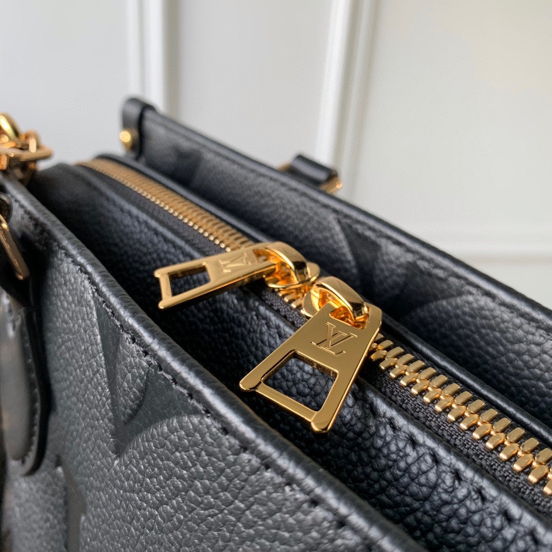 ONTHEGO EAST WEST BAG 25 IN BLACK MONOGRAM EMBOSSED COWHIDE