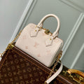 SPEEDY BANDOULIÈRE 20.5 IN LIGHT PINK MONOGRAM EMPREINTE CANVAS