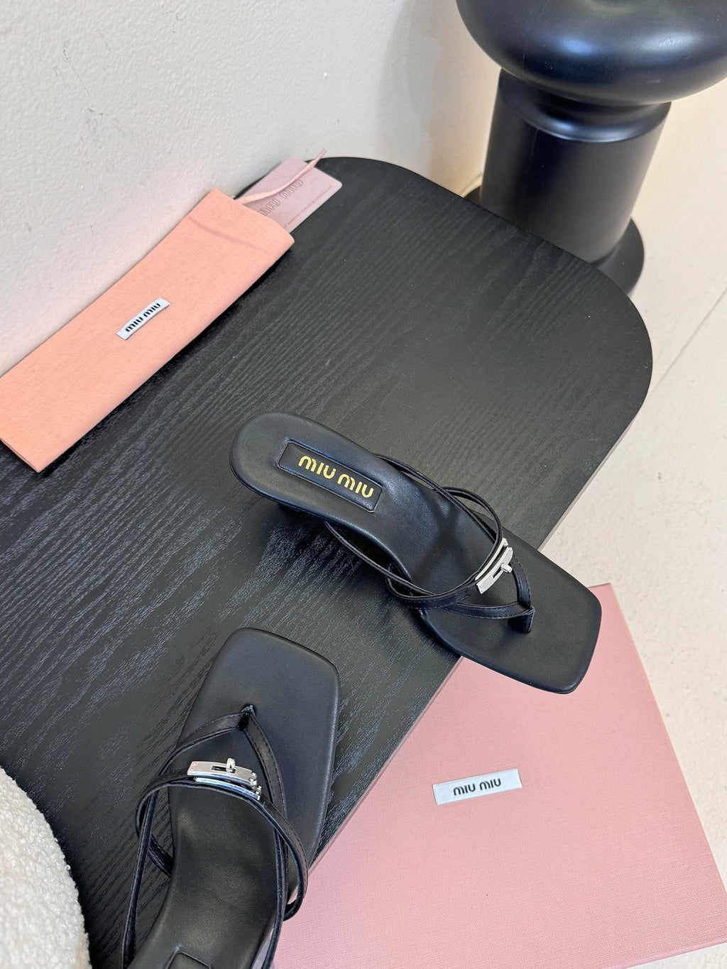 MIUMIU 26S LOW-HEEL THONG SANDALS IN BLACK CALFSKIN