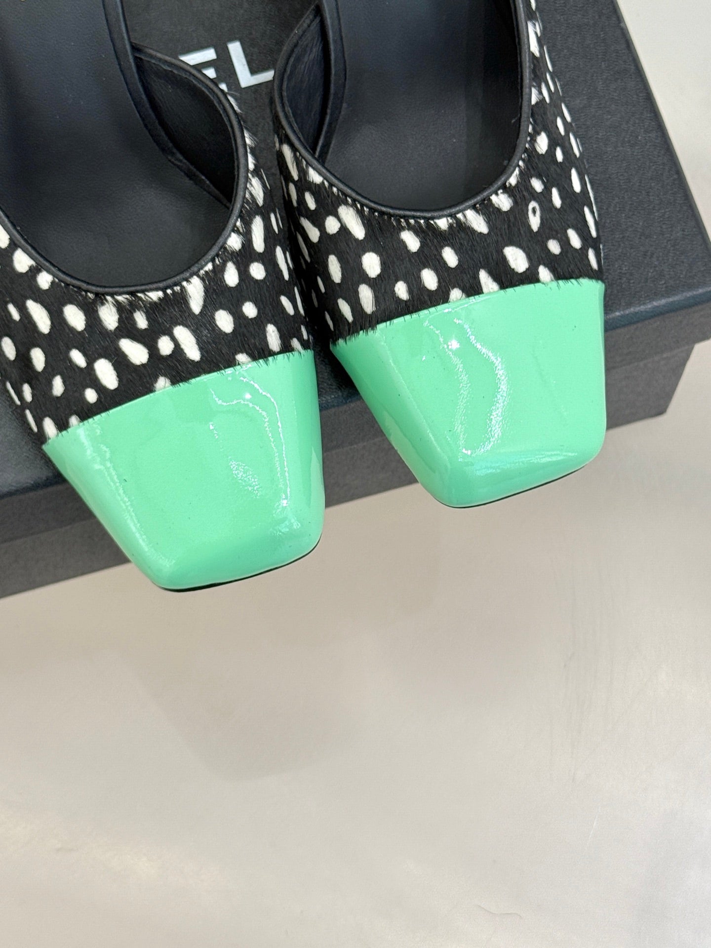 CHANEL POLKA DOT PATTERN MULES IN BLACK MIX GREEN FUR
