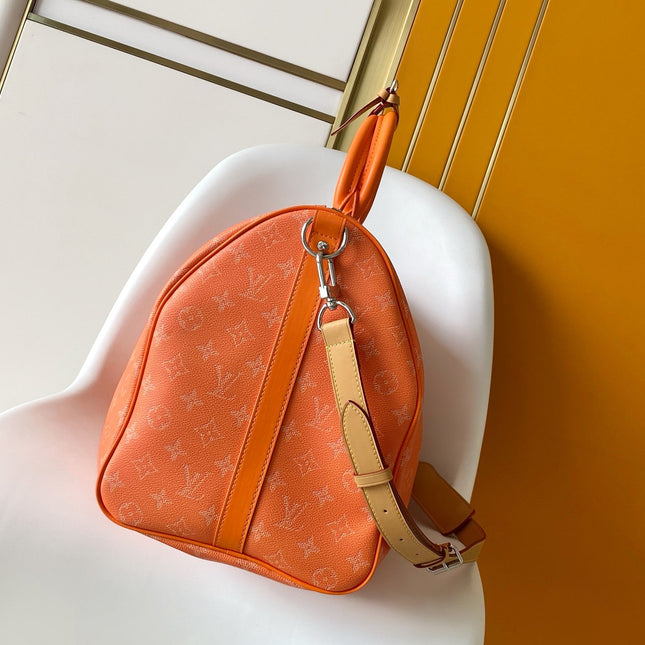 LV 26S KEEPALL 50 IN ORANGE MONOGRAM CANVAS